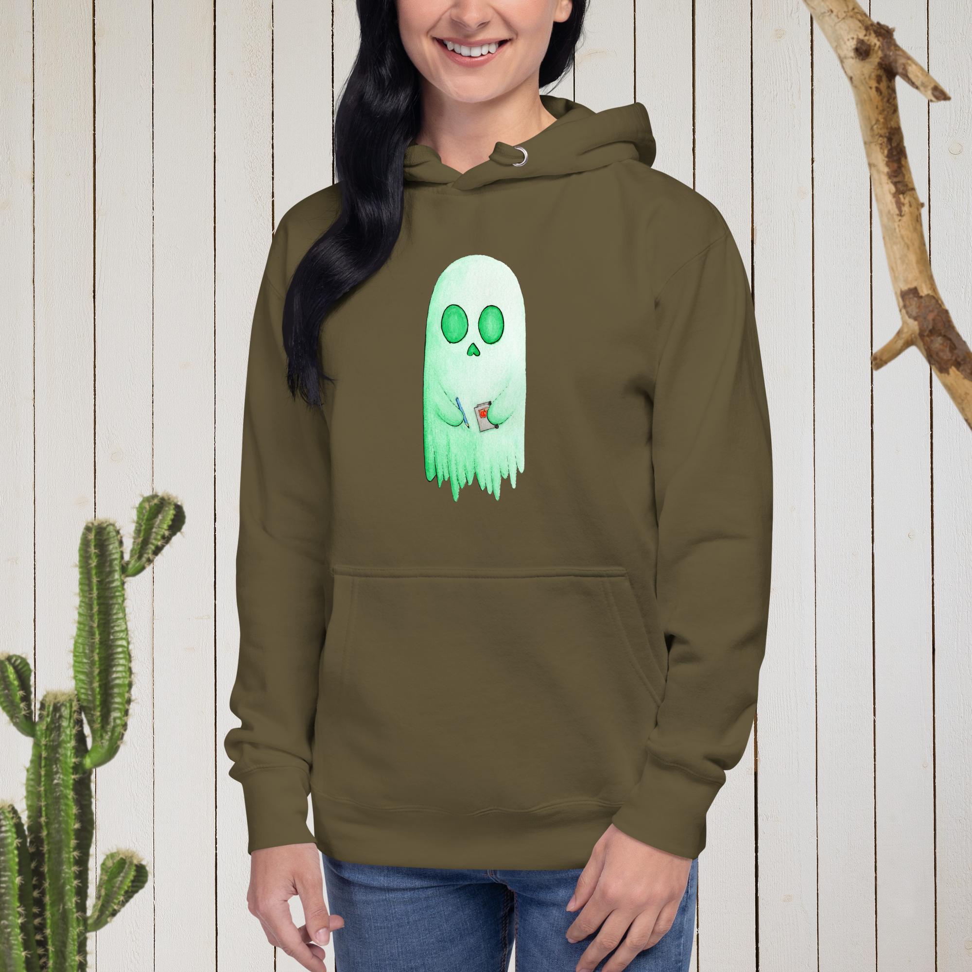 A woman model wearing a military green hooded sweatshirt with an artist skeleghost art on the front.